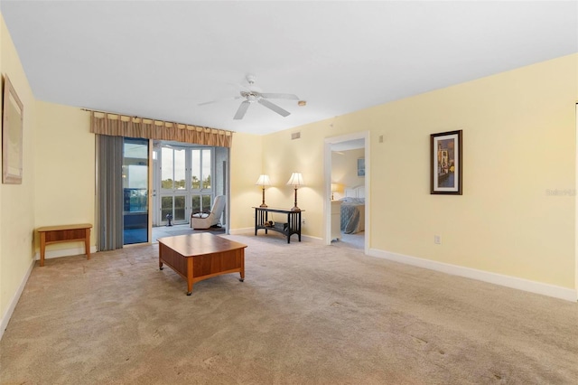 living room with light carpet and ceiling fan