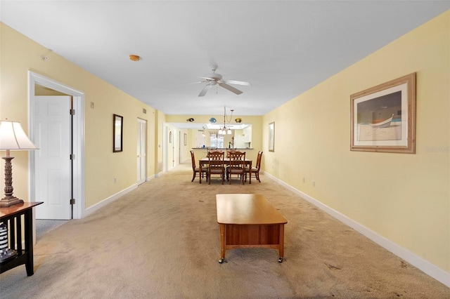 carpeted dining area featuring ceiling fan