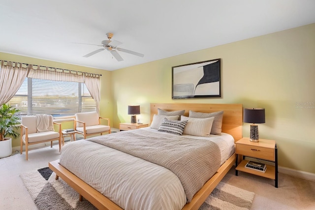 bedroom with light carpet and ceiling fan