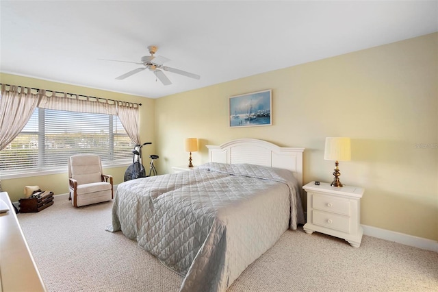 bedroom with light carpet and ceiling fan