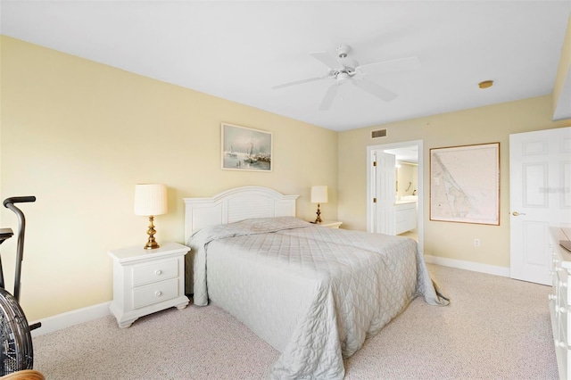 carpeted bedroom featuring ceiling fan and connected bathroom