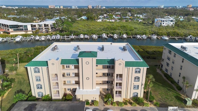 birds eye view of property with a water view