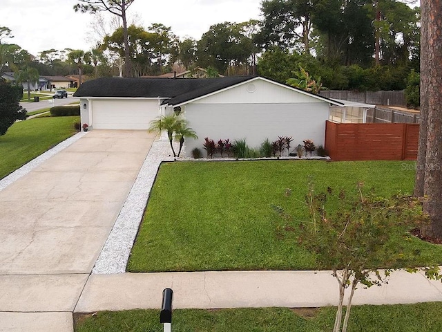 view of front of house featuring a front yard and a garage