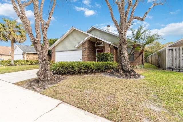 view of front of home with a garage and a front lawn