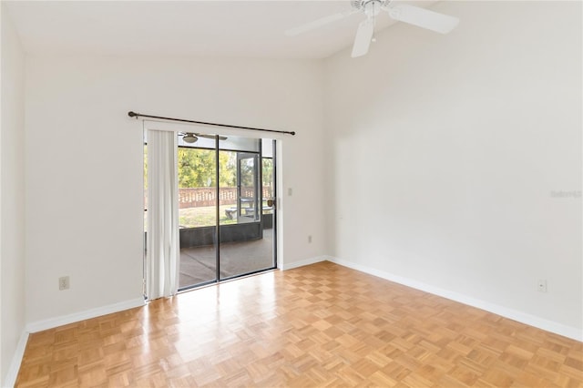 empty room featuring light parquet floors, high vaulted ceiling, and ceiling fan