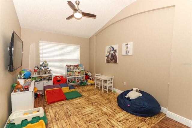 rec room with lofted ceiling and ceiling fan