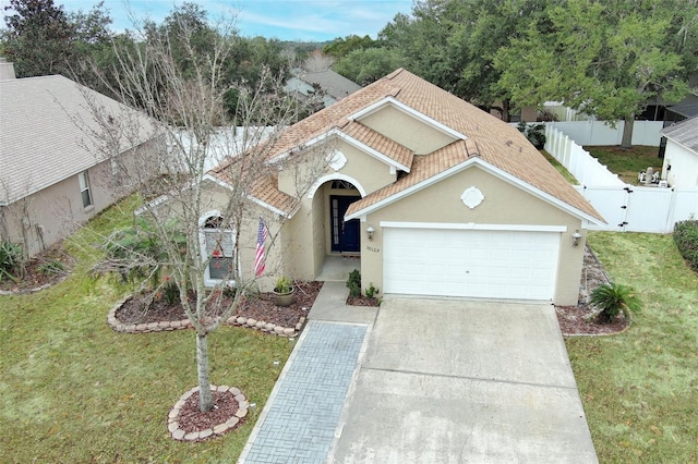 view of front facade with a garage and a front yard