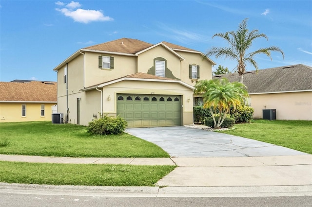 view of property with a garage, a front lawn, and cooling unit