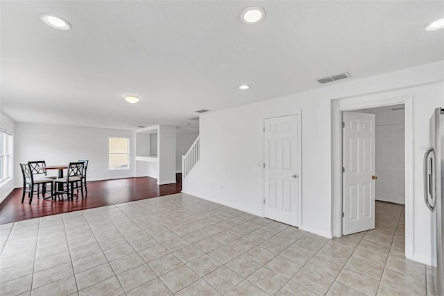 interior space featuring light tile patterned floors