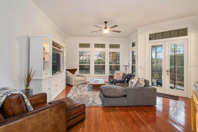 living room with hardwood / wood-style flooring, french doors, ceiling fan, and ornamental molding