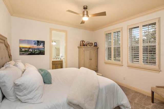 bedroom featuring ceiling fan, connected bathroom, crown molding, and carpet flooring