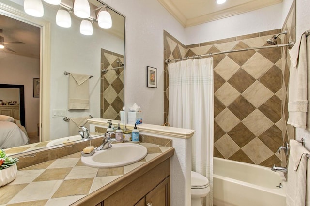 full bathroom featuring crown molding, ceiling fan, toilet, vanity, and shower / bath combo with shower curtain