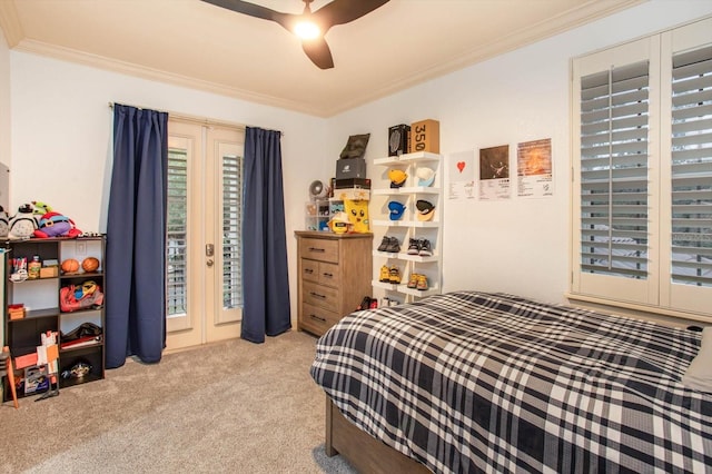 bedroom featuring ceiling fan, crown molding, and light carpet