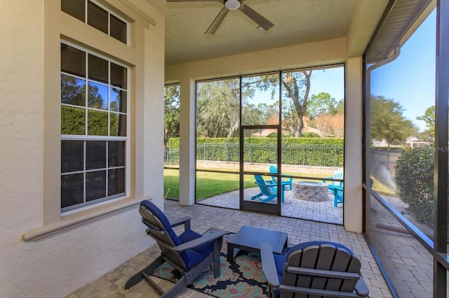 sunroom / solarium with ceiling fan