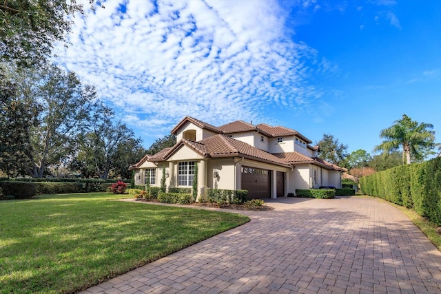 mediterranean / spanish-style house with a front yard