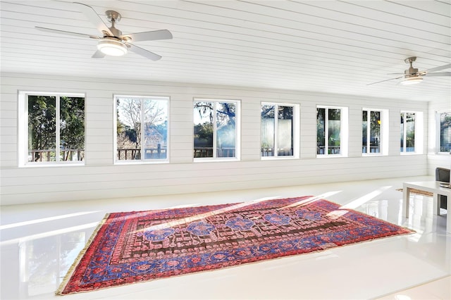 sunroom with wood ceiling and ceiling fan