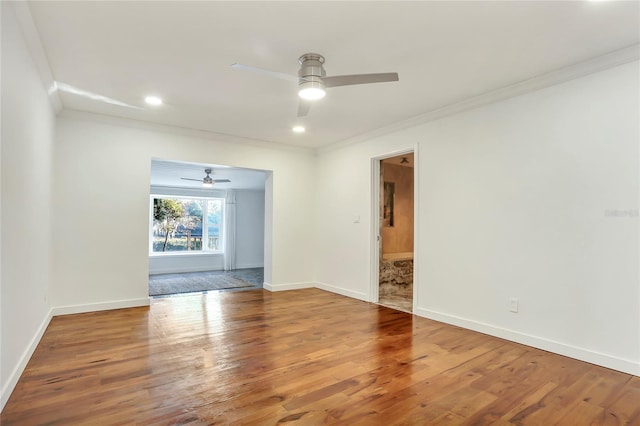 unfurnished room with wood-type flooring, ornamental molding, and ceiling fan