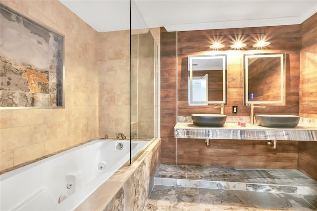 bathroom with tiled shower / bath combo and vanity