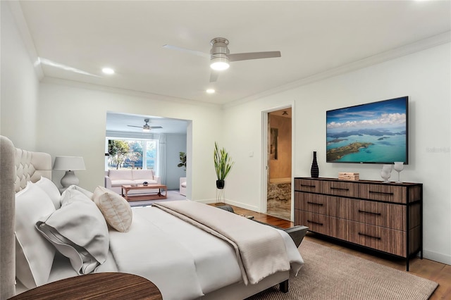 bedroom with ceiling fan, ornamental molding, ensuite bath, and light hardwood / wood-style floors