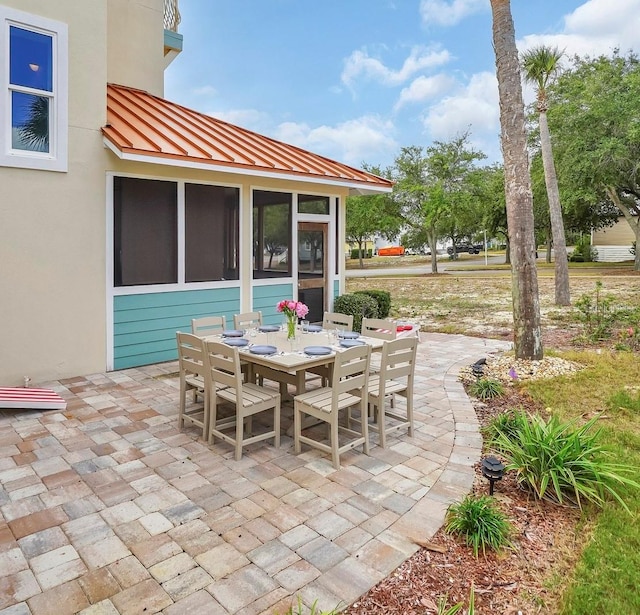 view of patio / terrace with a sunroom