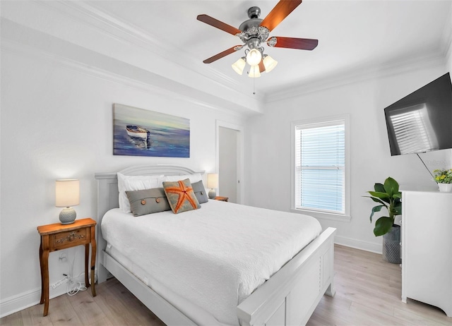 bedroom featuring ceiling fan, light hardwood / wood-style flooring, and crown molding