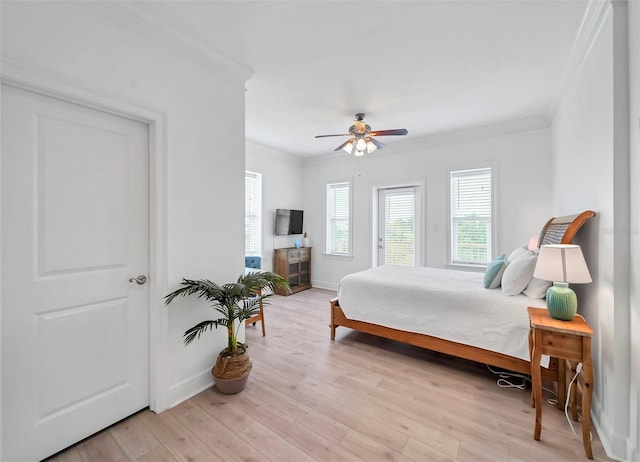 bedroom with ceiling fan, light hardwood / wood-style floors, and ornamental molding