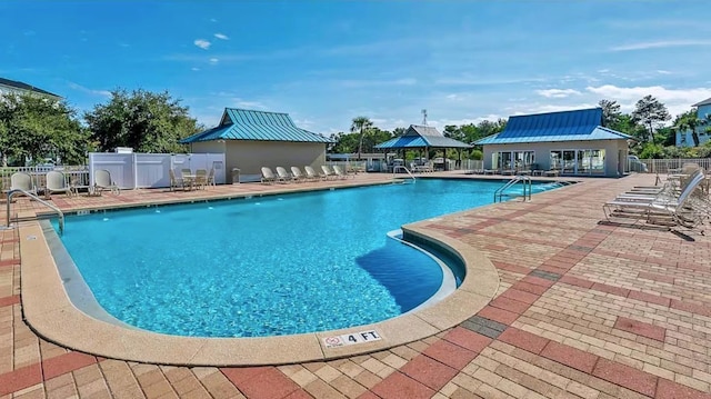 view of swimming pool featuring a gazebo and a patio