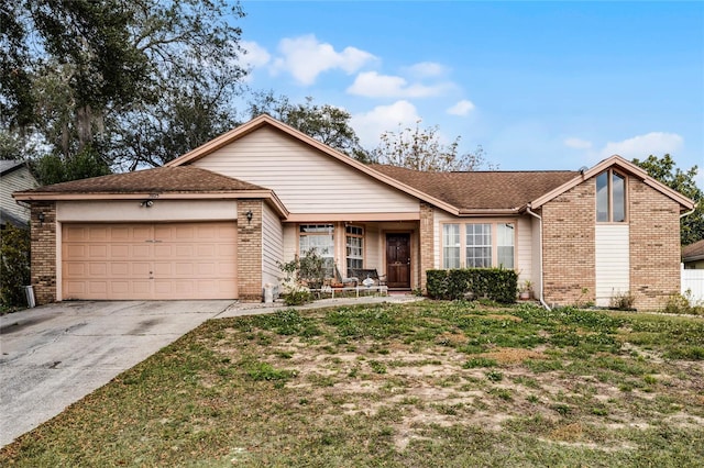 ranch-style home with a garage and a front lawn