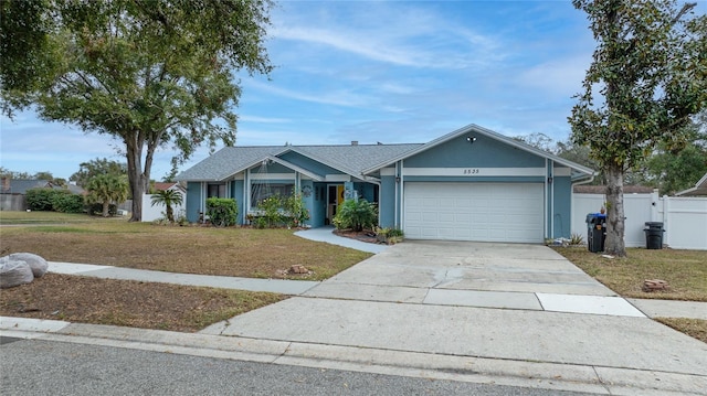 single story home with a garage and a front yard