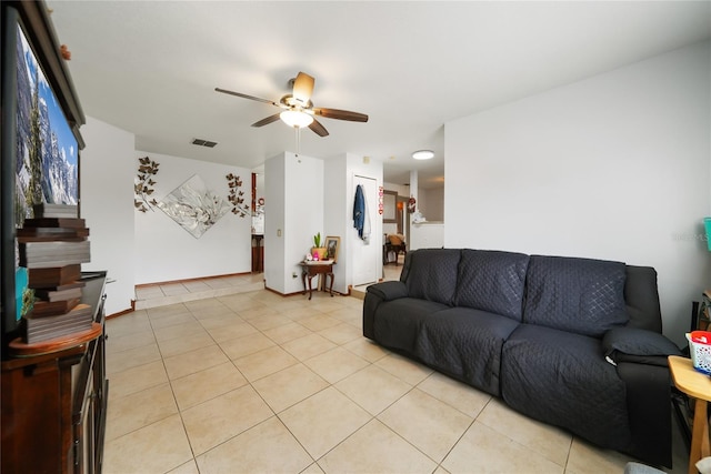 living room with light tile patterned flooring and ceiling fan