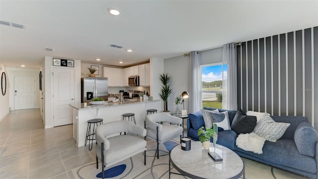 living room featuring light tile patterned flooring