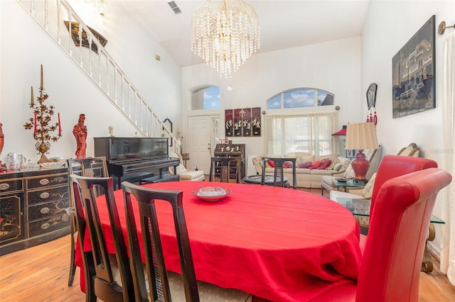 dining room featuring hardwood / wood-style flooring and a notable chandelier