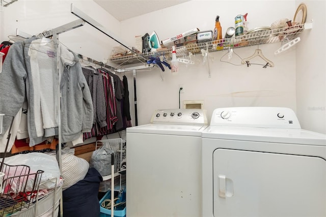 clothes washing area featuring washing machine and dryer