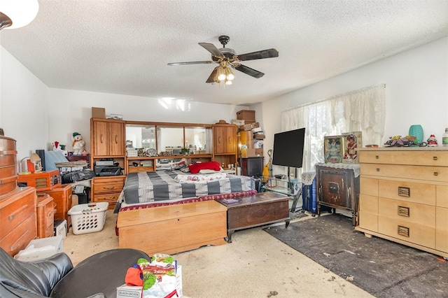 interior space featuring ceiling fan and a textured ceiling