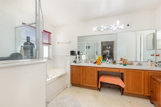 bathroom with independent shower and bath and vanity