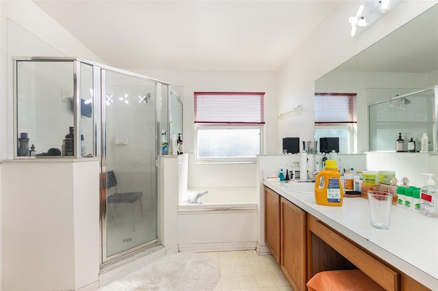 bathroom featuring vanity and shower with separate bathtub