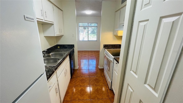 kitchen with white cabinetry, sink, white appliances, and a textured ceiling