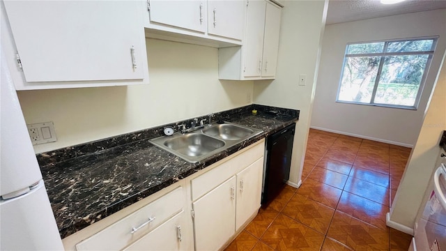 kitchen featuring sink, white cabinets, dishwasher, and white refrigerator