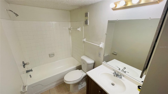 full bathroom with a textured ceiling, tile patterned flooring, washtub / shower combination, vanity, and toilet