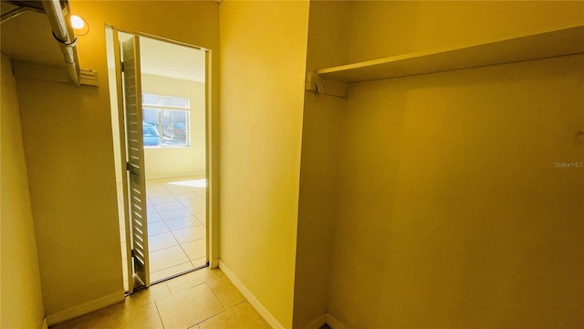 walk in closet featuring light tile patterned floors