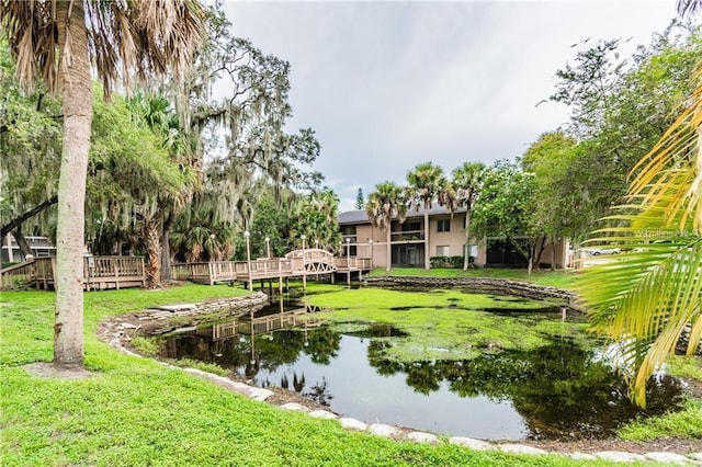 surrounding community featuring a yard and a deck