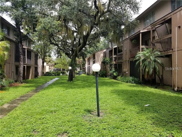 view of community featuring a lawn