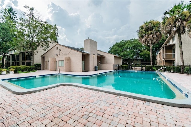 view of swimming pool featuring a patio