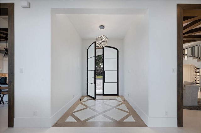 entrance foyer with a chandelier