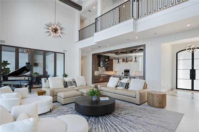 living room with french doors and a chandelier