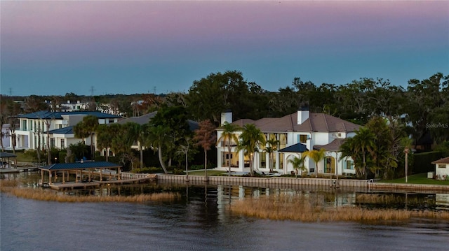 aerial view at dusk with a water view