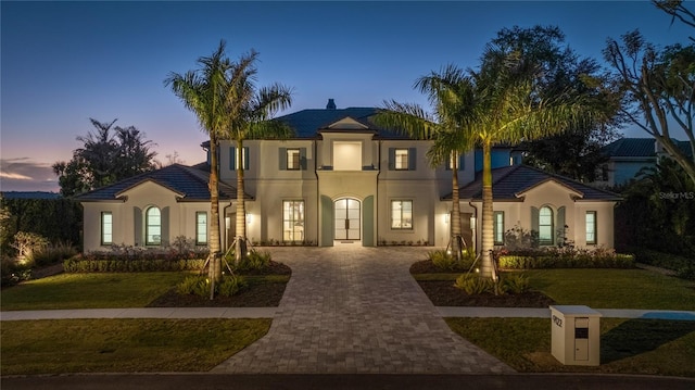 mediterranean / spanish-style house featuring a yard