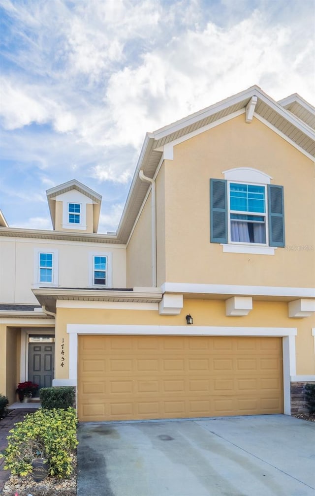 view of front of property with a garage