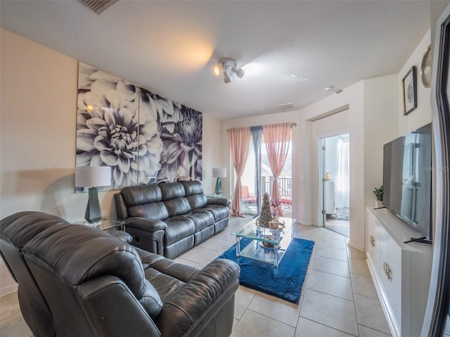 living room with light tile patterned floors