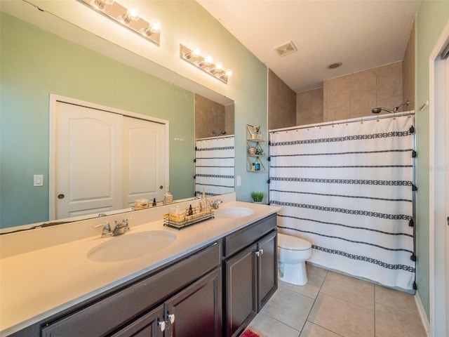 bathroom featuring vanity, curtained shower, tile patterned floors, and toilet